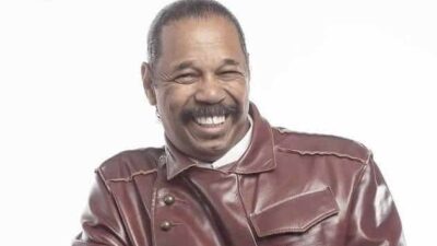 Victor Orlando in brown jacket
