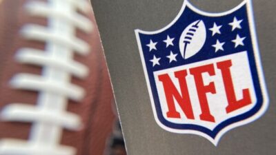 The NFL logo is seen on a football / Getty