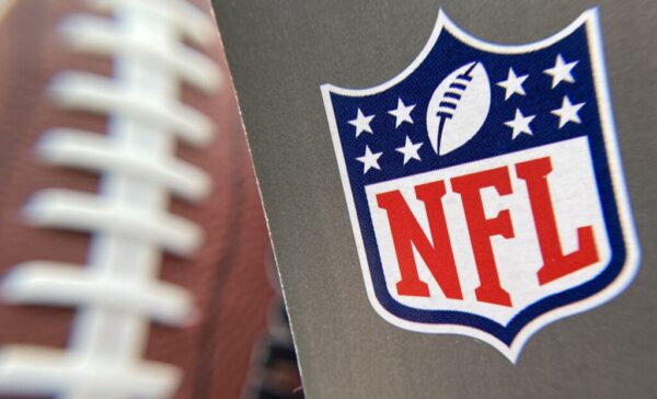 The NFL logo is seen on a football / Getty
