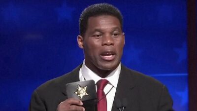 Herschel Walker (honorary police badge at debate) - screenshot