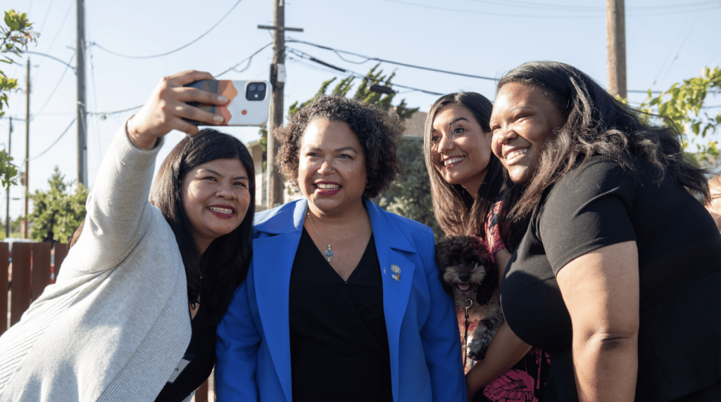 Photo: Assemblymember Mia Bontà takes selfies with community members in district 18