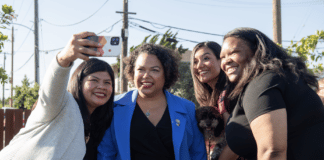 Photo: Assemblymember Mia Bontà takes selfies with community members in district 18