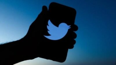 Twitter - hand witrh twitter logo on smartphone - Getty