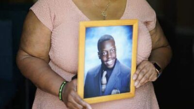 Tyrell Wilson's Mother with pic of him - (John Locher-AP)