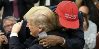 Donald Trump gets hugged by KanYe West (Getty)
