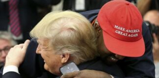 Donald Trump gets hugged by KanYe West (Getty)