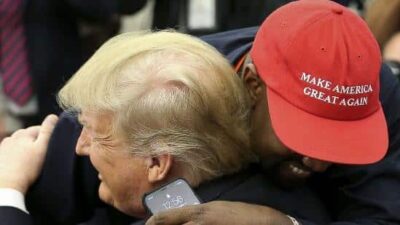 Donald Trump gets hugged by KanYe West (Getty)