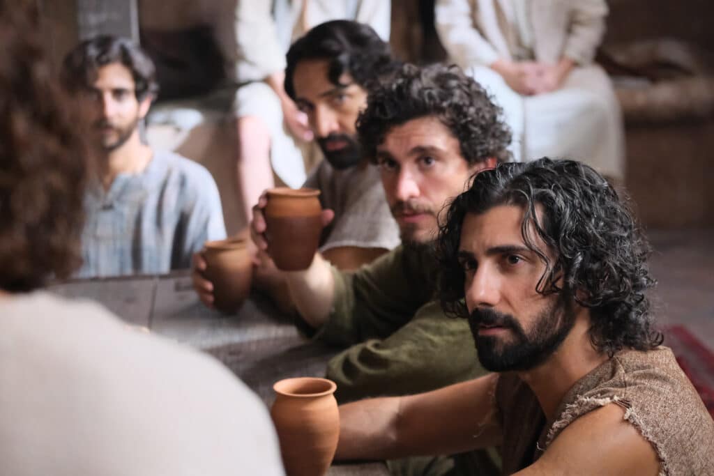 Andrew and the other disciples listen intensely to Jesus Christ. Photo Credit: The Chosen/Angel Studios