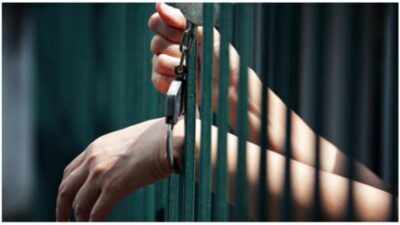 handcuffed in jail