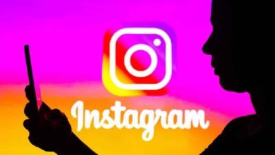 Instagram (person on phone & logo) - Getty