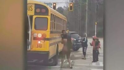 Parents pulling kids from bus windows - screenshot