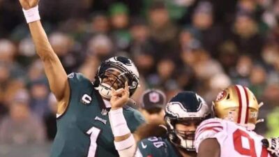 Philadelphia Eagles' Jalen Hurts throws pass in 2023 NFC Championship Game against 49er - Getty