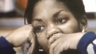 Stephanie Mills at age 19 sits at her kitchen table