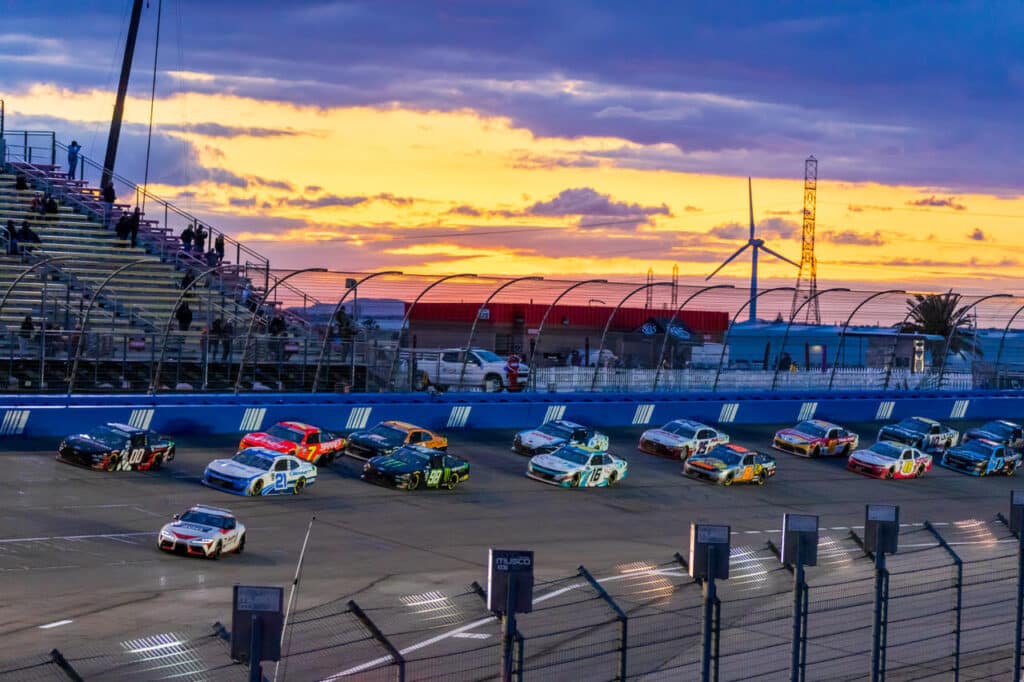 Drivers resume the race at the final NASCAR race on Auto Club Speedway's 2 mile configuration in Fontana, California on February 26, 2023. (Maxim Elramsisy | California Black Media)