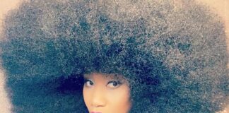 Aevin Dugas shows off her record setting afro