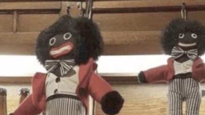 Golliwog dolls displayed behind bar at The White Hart pub