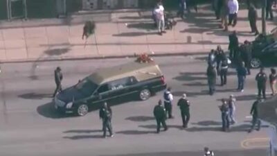 Hearse in Chicago surrounded by police after a shooting at a funeral - screenshot
