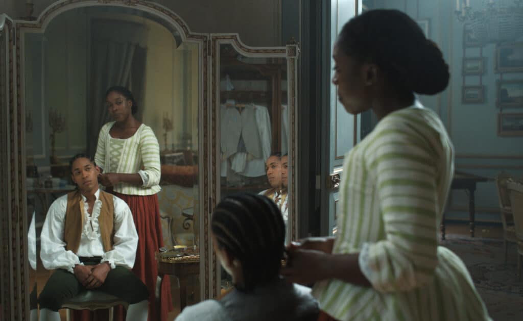 Kelvin Harrison Jr. and Ronke Adekoluejo in CHEVALIER