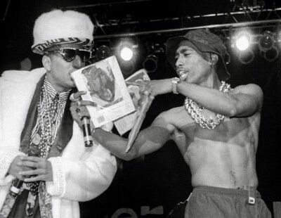 Shock G of Digital Underground and Tupac Shakur on stage