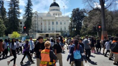 An estimated 2,700 students, civil rights, and education leaders demonstrated their opposition to the Governor's proposed education budget by marching around the State Capitol in Sacramento on April 11, 2023. CBM photo by Antonio Ray Harvey.