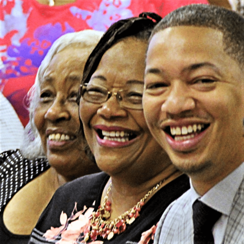Tyronn Lue poses with his mom and grandma