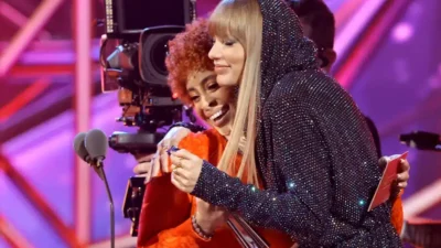 Ice Spice presents the Song of the Year award to Taylor Swift onstage during the 2023 iHeartRadio Music Awards
