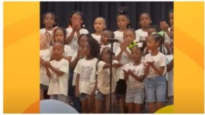 Little girl steals the show at kindergarten graduation performance