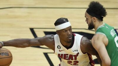 Jimmy Butler and Derrick White (Rebecca Blackwell-AP)