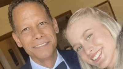 Monica poses with her father