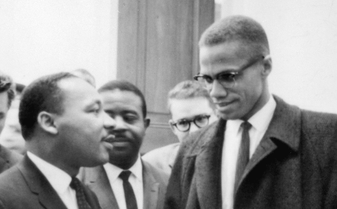 cropped: Martin Luther King Jr. and Malcolm X waiting for a press conference on March 26, 1964.