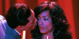 Ike Turner (Laurence Fishburne) kisses Tina Turner (Angela Bassett) in a scene from "What's Love Got to Do With It"