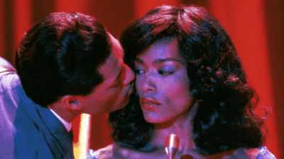 Ike Turner (Laurence Fishburne) kisses Tina Turner (Angela Bassett) in a scene from "What's Love Got to Do With It"