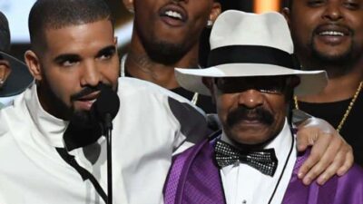 Drake hugs his father, Dennis Graham