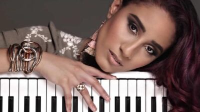 Kayla Waters with keyboard - via Presence album