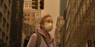 Person wearing face mask in smoke-filled NYC (Chine Nouvelle-Sipa-Shutterstock)