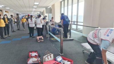 Woman Trapped in Thai Airport Moving Walkway