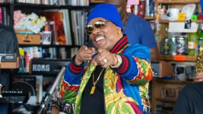 Charlie Wilson points at the camera during his NPR Tiny Desk concert