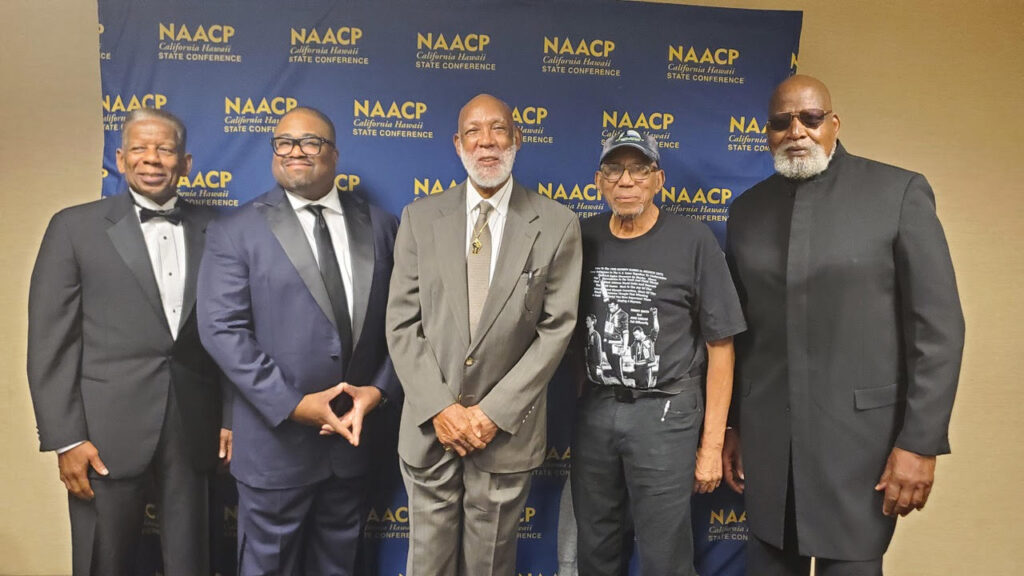 Shown left to right at the CA/HI NAACP Legacy Hall of Fame ceremony, Darrell Goode (received award for Dr. Tommie Smith), Rick Callendar (CA/HI NAACP president), Dr. John Carlos (Legacy Hall of Fame recipient), Dr. Kenneth Noel (Legacy Hall of Fame recipient), and Dr. Harry Edwards (Legacy Hall of Fame recipient). Dr. Tommie Smith, a gold medalist in the 1968 Olympics, could not attend the induction ceremony in Sacramento. June 24, 2023. CBM photo by Antonio Ray Harvey.