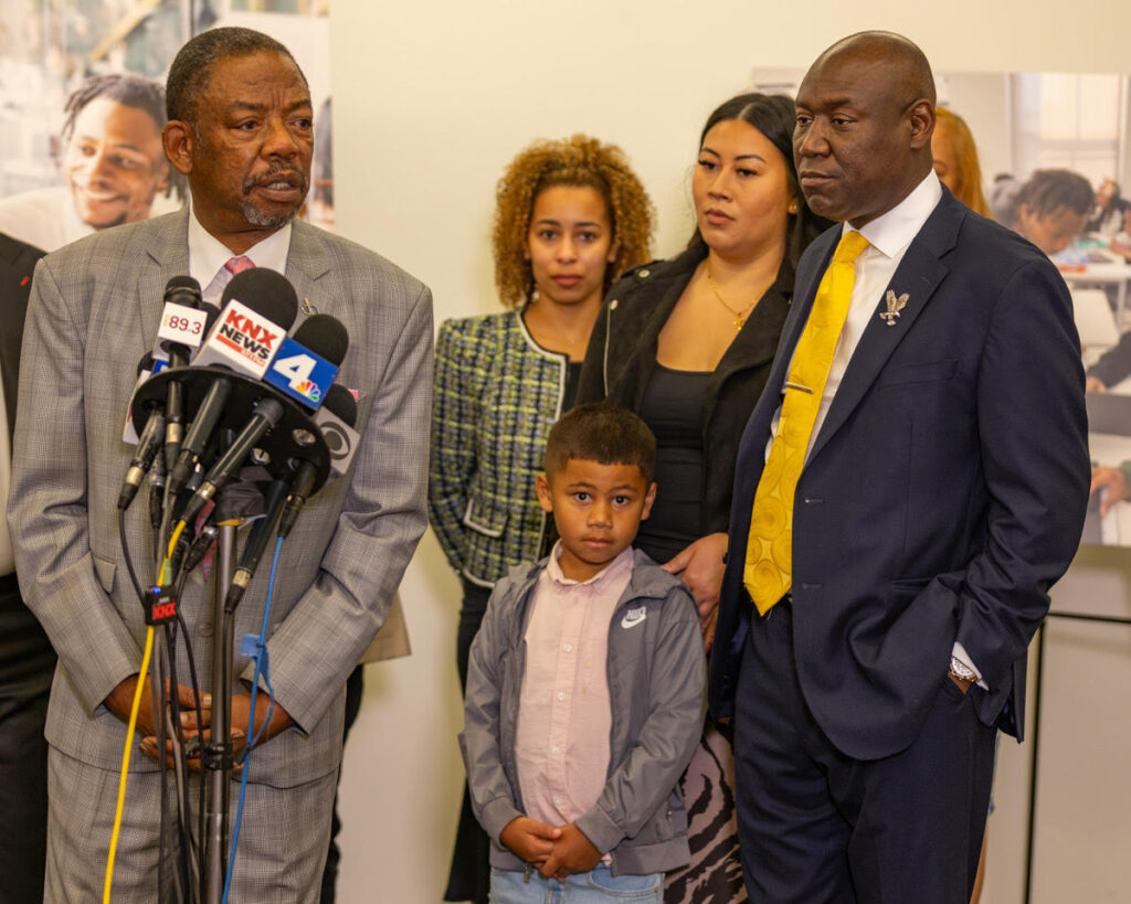 Attorneys Carl Douglas (left) and Ben Crump (right) pictured with the family of Keenan Anderson in Los Angeles, California, on June 19, 2023. They announced a $100 million civil lawsuit against the City of Los Angeles in the wrongful death of Anderson, a 30-year-old school teacher from Washington D.C. who died after he was tased repeatedly by Los Angeles Police Officers. (Maxim Elramsisy | California Black Media)