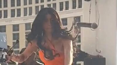 Cardi B throws mic at person who hurled liquid on her