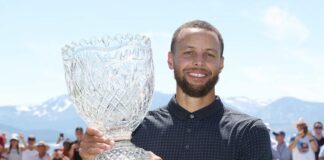 Steph Curry poses with Golf trophy (Isaiah Vazquez-Getty Images)
