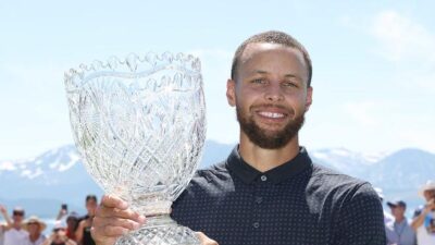 Steph Curry poses with Golf trophy (Isaiah Vazquez-Getty Images)
