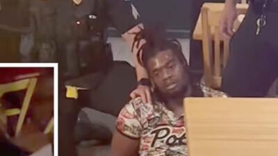 Cops punch Black man holding a BABY to the ground in Applebee's restaurant - screenshots