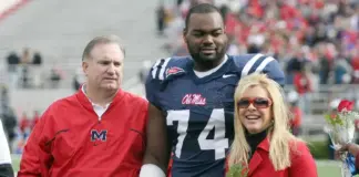 Michael Oher with Sean and Leigh Anne Tuohy (Matthew Sharpe-Getty Images)