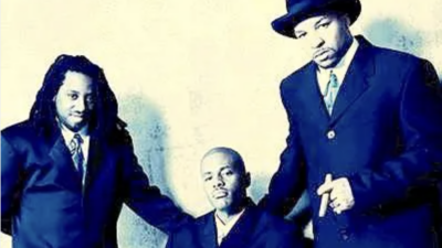 Something For the People pose in suits for a publicity photo