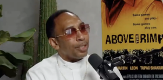 Stephen A. Smith, in a white button-down and red-tinted sunglasses, speaks on the "Podcast P with Paul George: podcast