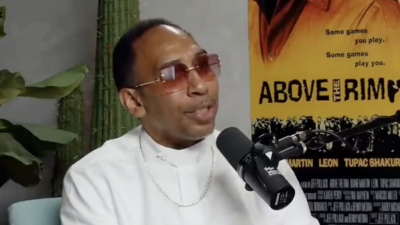 Stephen A. Smith, in a white button-down and red-tinted sunglasses, speaks on the "Podcast P with Paul George: podcast