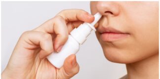 woman using nasal spray