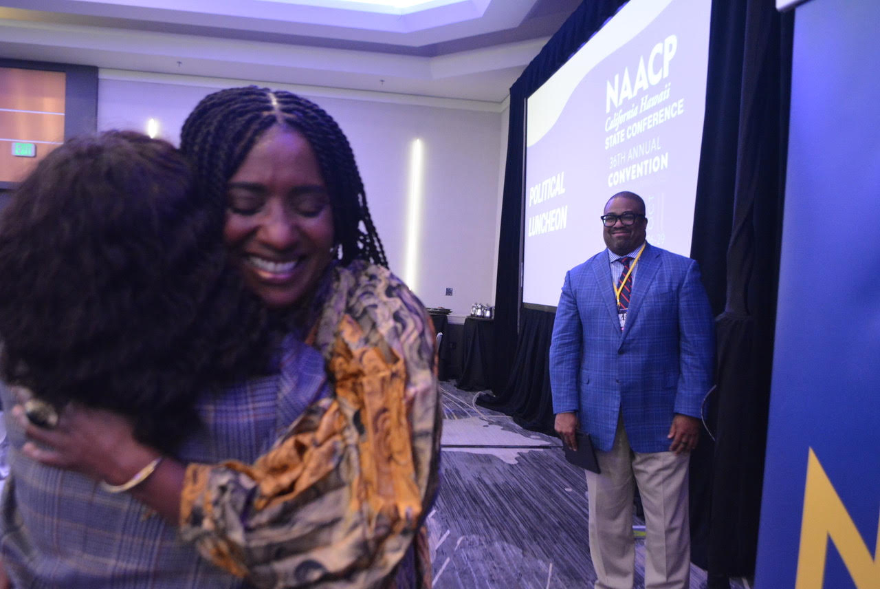 Oakland City Councilwoman Treva Reid receives a passionate hug after her speech during the NAACP California-Hawaii State Conference Luncheon on Oct. 28, 2023. CBM photo by Antonio Ray Harvey.