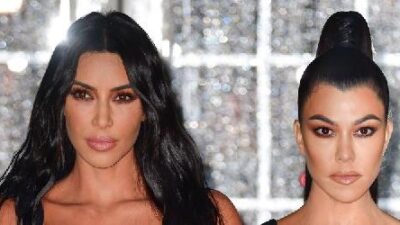 Kim and Kourtney Kardashian - Getty
